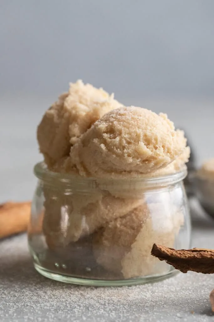 snickerdoodle cookie dough scoops in a glass jar